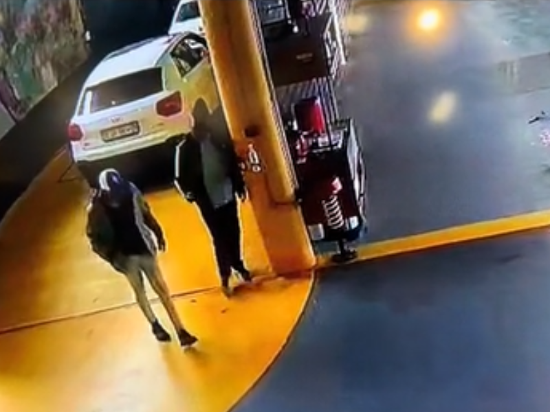 Two men walking inside a carwash in Ballito