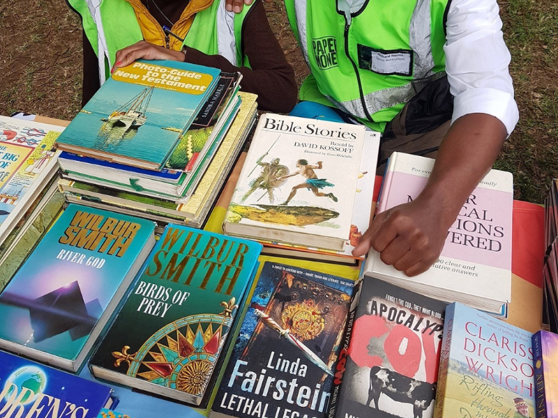 Two people selling secondhand books