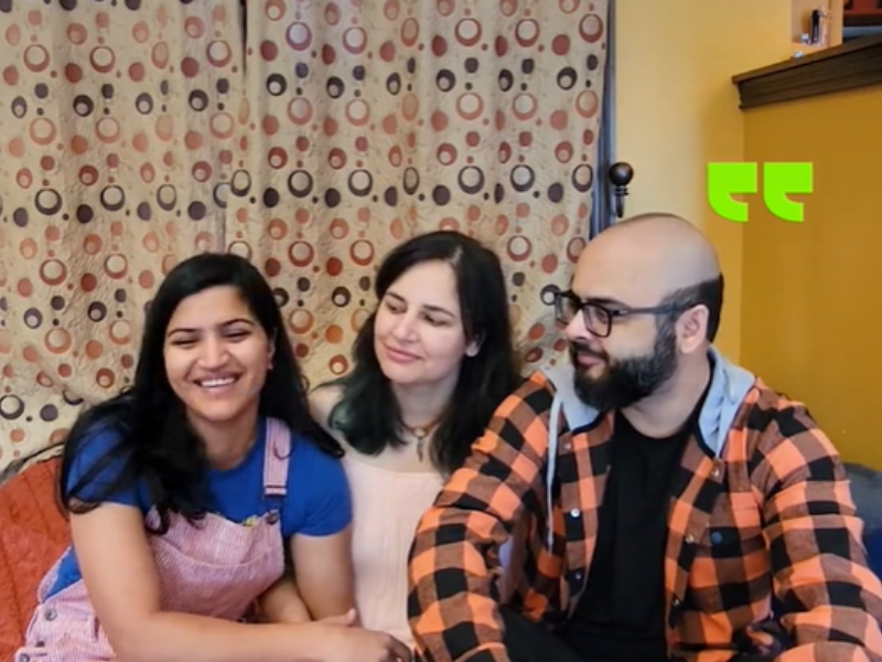 Two women and a man sit together