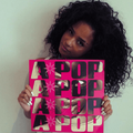 Tyla holding a  vinyl copy of her A-POP album