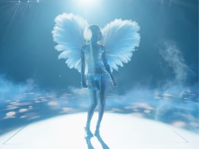 Tyla wearing Victoria's Secret Angel wings .png