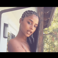 Tyla's hair styled in feed in side braids