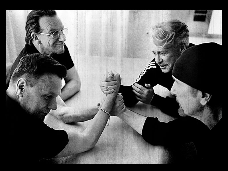 A black and white picture of U2 members