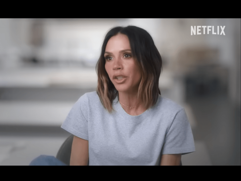 Victoria Beckham wearing a grey t-shirt