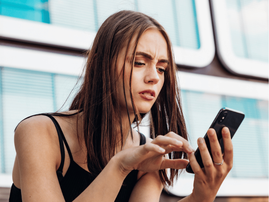 WOMAN CHECKING PHONE