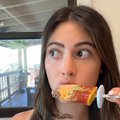 WOMAN EATING BURGER POPSICLE
