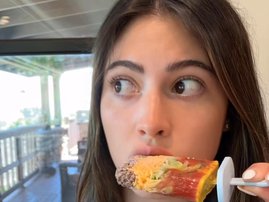 WOMAN EATING BURGER POPSICLE