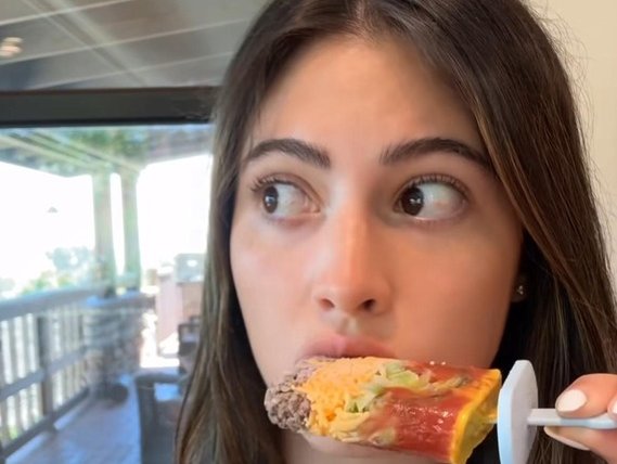WOMAN EATING BURGER POPSICLE
