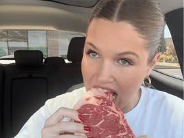 WOMAN EATS RAW MEAT IN CAR