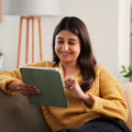 WOMAN ON TABLET READING EBOOK
