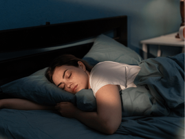 WOMAN SLEEPING ON BED
