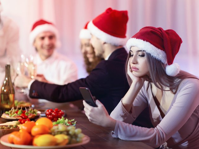 WOMAN UNHAPPY AT CHRISTMAS DINNER