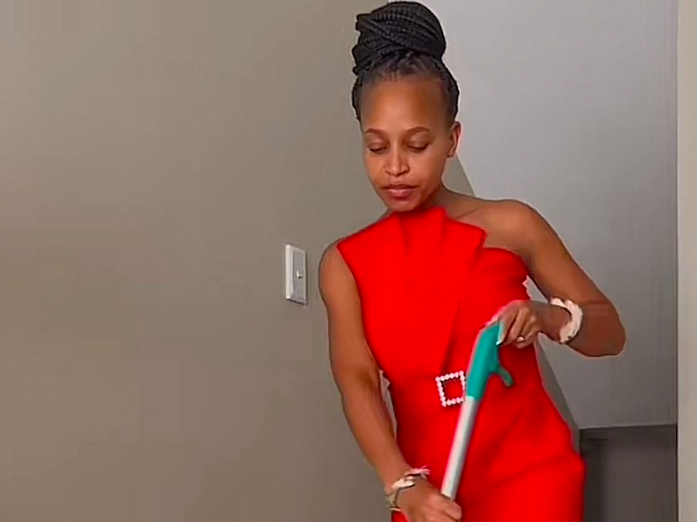 WOMAN WEARS DRESSES TO CLEAN HOME