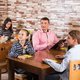 Waitress serving family