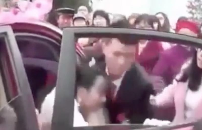 Angry groom forcefully drags bride from car on wedding day