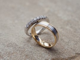 Wedding rings on a stone background