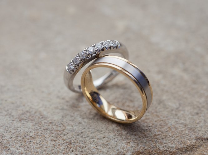 Wedding rings on a stone background