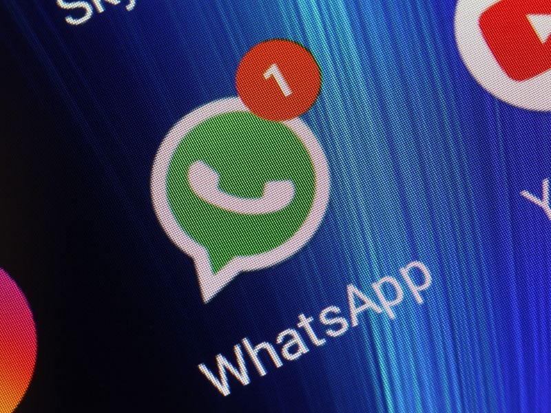 Stock image of WhatsApp icon on phone