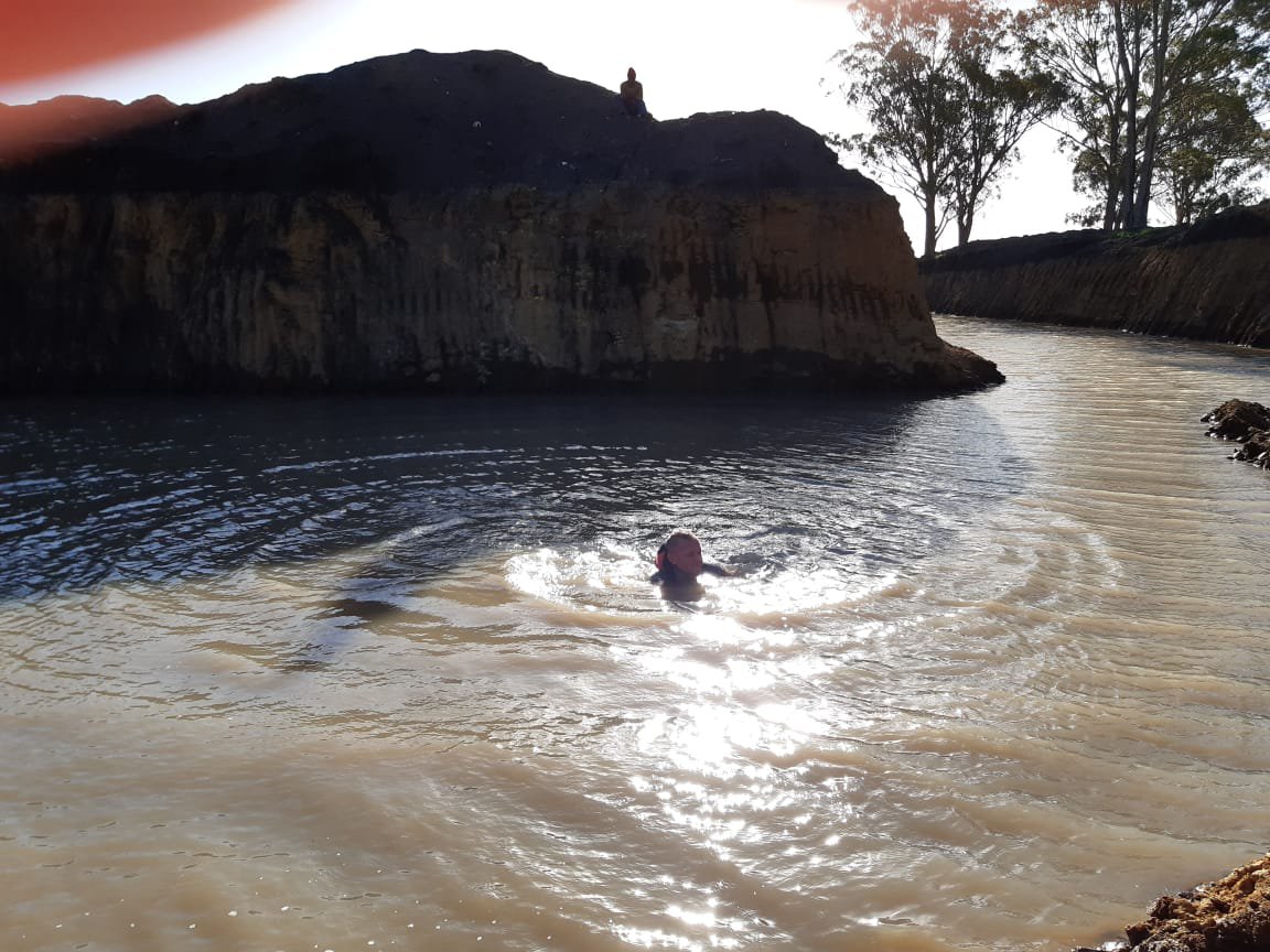 rain water fills excavation site