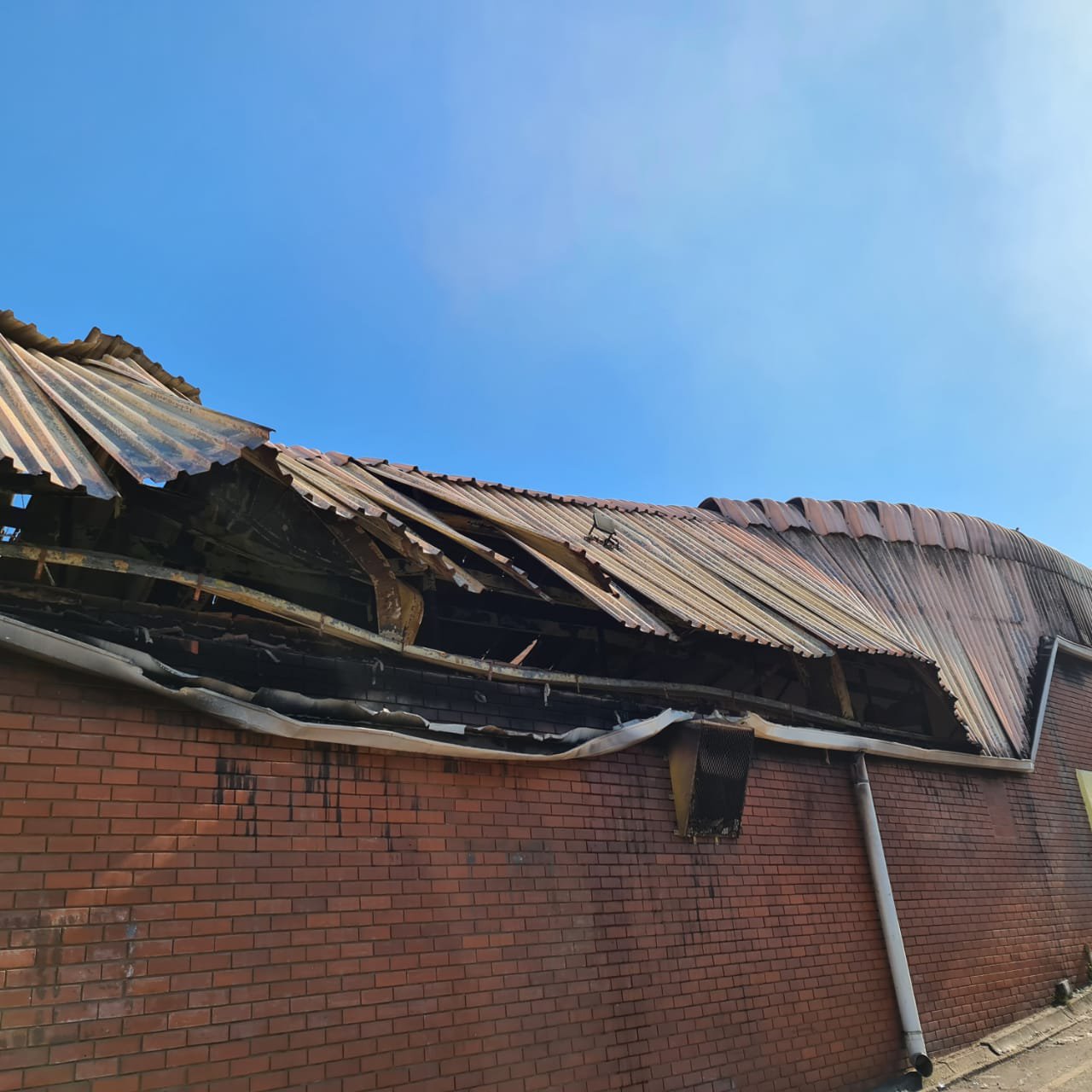 "My childhood. My grandparents shop. Looted and on fire as of this morning. I feel numb."