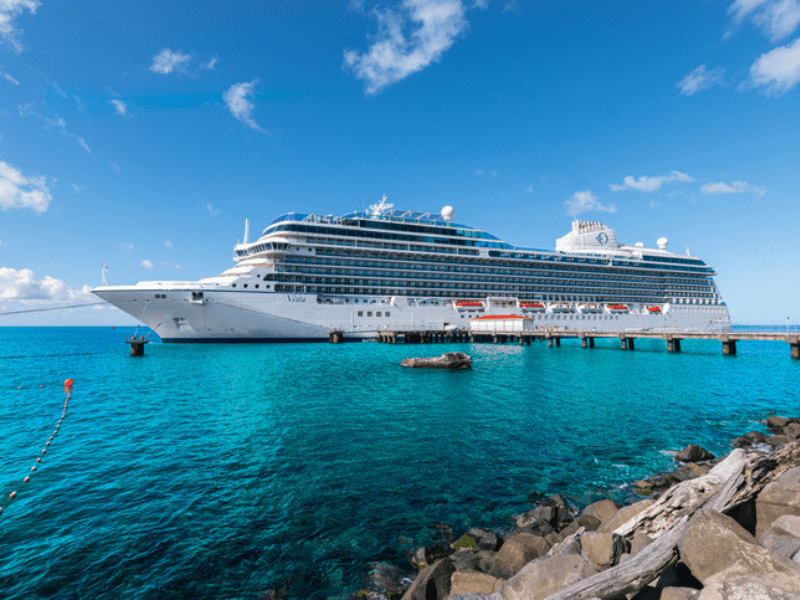 White cruise ship docked in Dominica