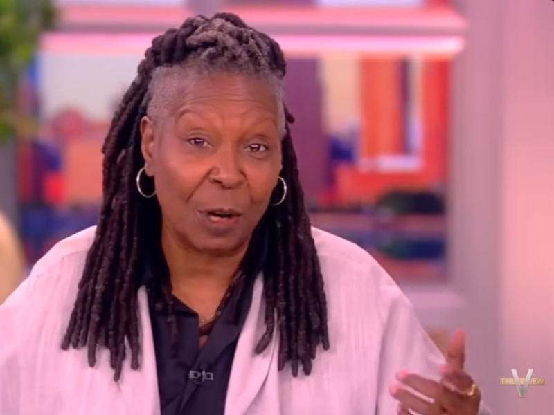Whoopi Goldberg wearing a pink blazer