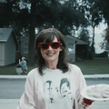 Winona Ryder wearing red glasses