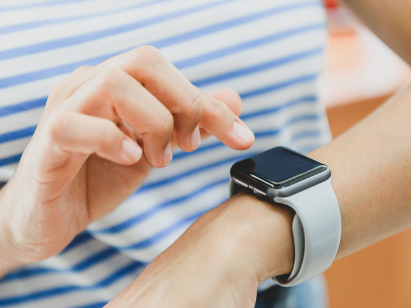 Woman actively using the technology on her smart watch