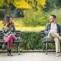 Man and woman sitting at a park