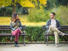 Man and woman sitting at a park