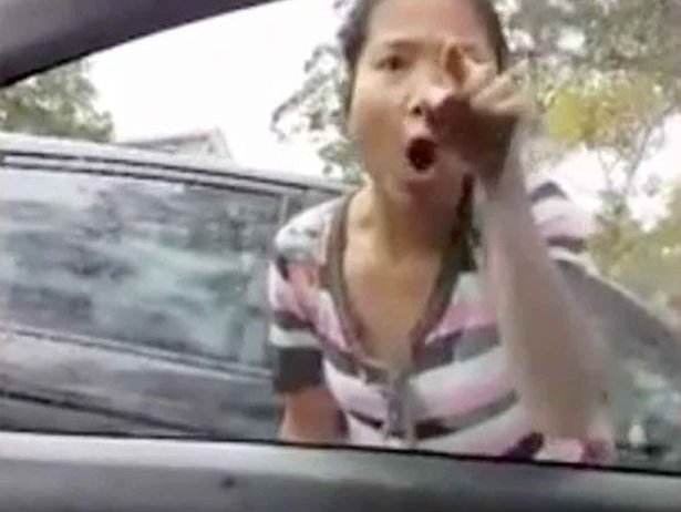woman bangs on window