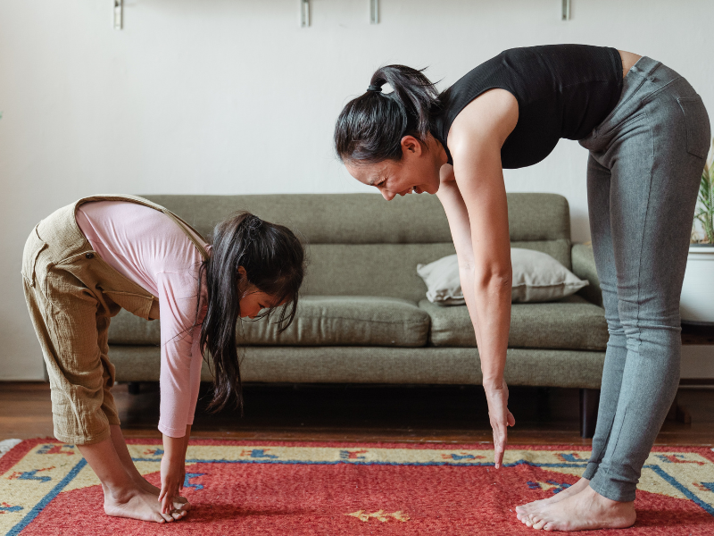 Woman exercising with her daughter