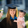 Woman graduate holding baby