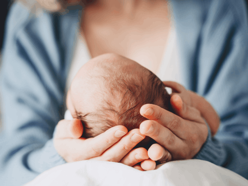 Woman holding a newborn baby