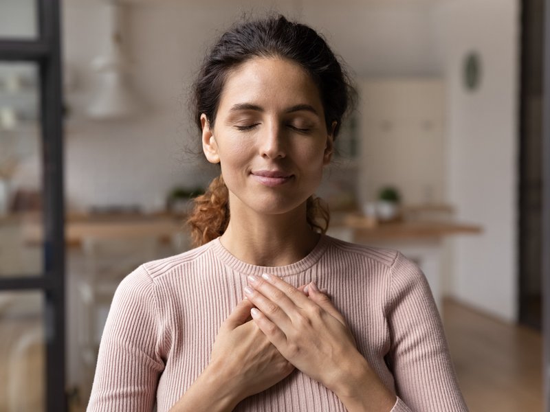 Woman hold hands on chest