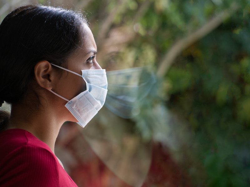 Woman wearing mask in isolation
