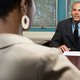 Woman talking with her boss in office