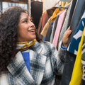 Woman looking at clothes in a vintage secondhand store