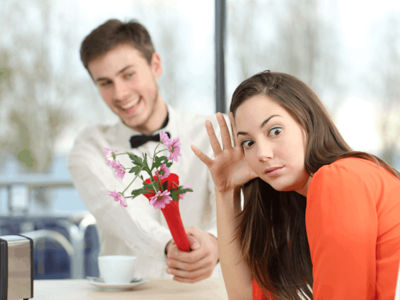 Woman rejecting man on a date couple