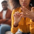 Woman removing ring from finger