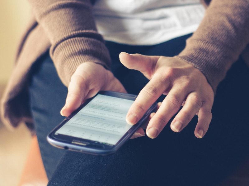 Woman scrolling on her smart phone