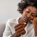 Sad woman staring at a ring