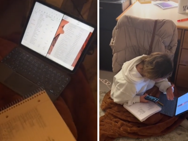 Woman sitting on the floor with laptop and book