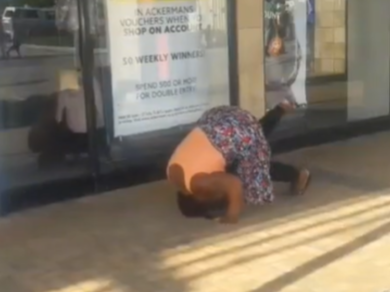 Woman somersaulting on the ground