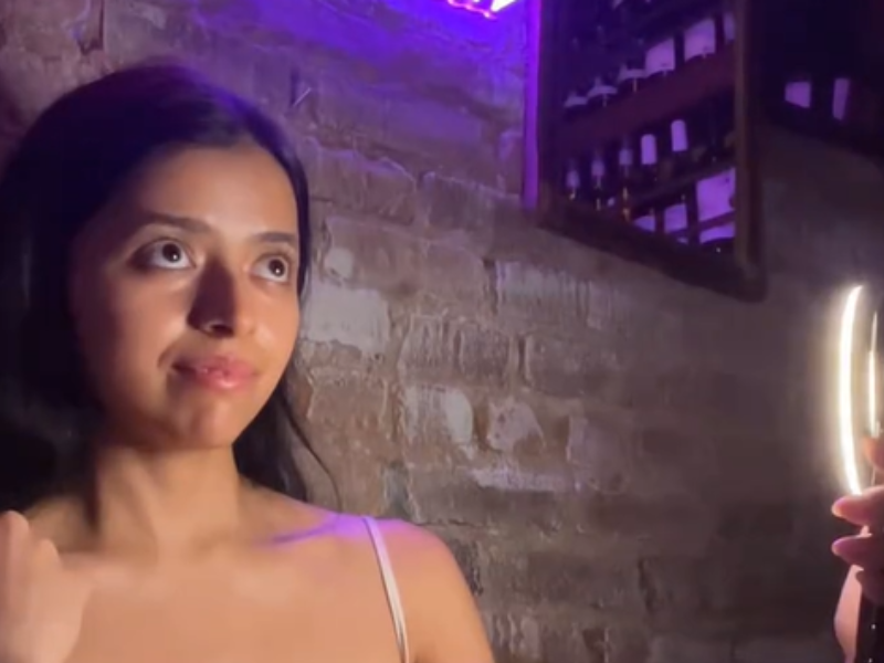 Woman taking selfies at a restaurant