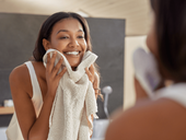 Woman washing her face during morning skin care routine-min.png