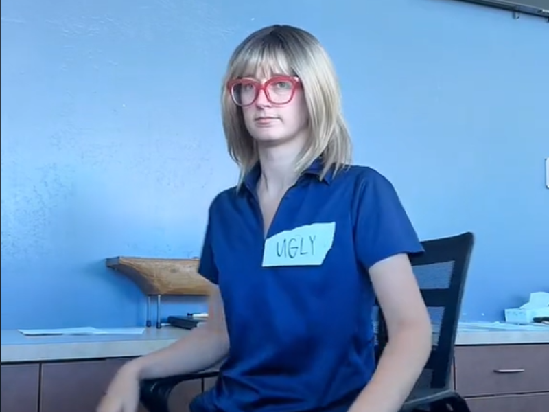 Woman wearing a blonde wig at work