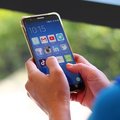 Women using social media apps on mobile smartphone screen