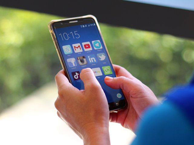 Women using social media apps on mobile smartphone screen