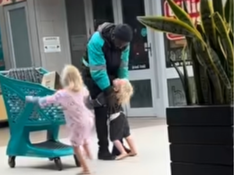 YOUNG BOY HUGGING CHECKERS DRIVER